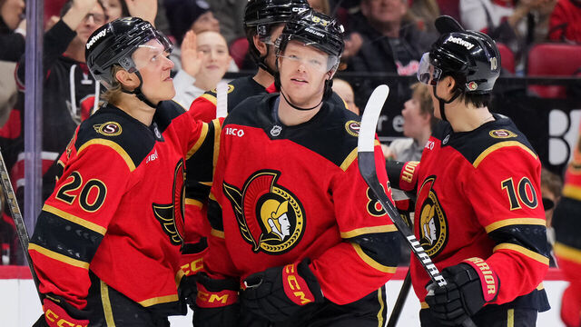 OTTAWA, CANADA - JANUARY 25: Stephen Halliday #83 of the Ottawa Senators celebrates his third-period goal against the Vegas Golden Knights with teammates Fabian Zetterlund #20 and Jordan Spence #10 on January 25, 2026 at Canadian Tire Centre in Ottawa, Ontario, Canada.