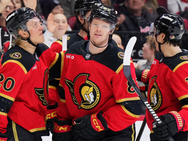 OTTAWA, CANADA - JANUARY 25: Stephen Halliday #83 of the Ottawa Senators celebrates his third-period goal against the Vegas Golden Knights with teammates Fabian Zetterlund #20 and Jordan Spence #10 on January 25, 2026 at Canadian Tire Centre in Ottawa, Ontario, Canada.