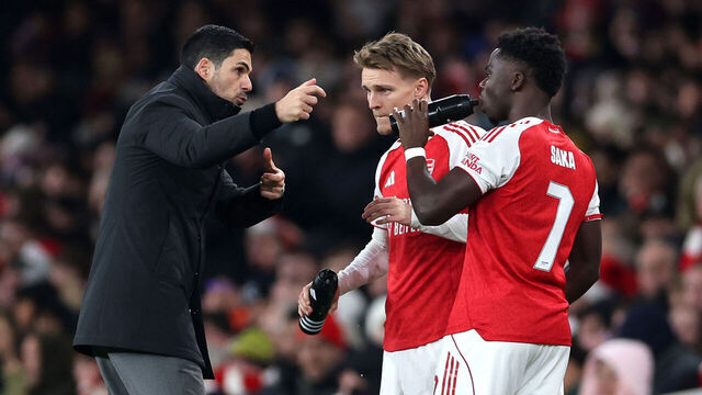 LONDON, ENGLAND - DECEMBER 23: Mikel Arteta, Manager of Arsenal, gives instructions to Martin Odegaard and Bukayo Saka of Arsenal as they prepare to come on as substitutes during the Carabao Cup Quarter Final match between Arsenal and Crystal Palace at Emirates Stadium on December 23, 2025 in London, England.