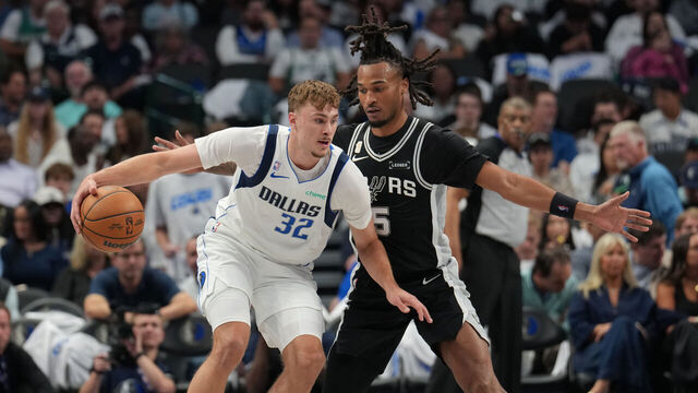 DALLAS, TX - OCTOBER 22: Cooper Flagg #32 of the Dallas Mavericks handles the ball as Stephon Castle #5 of the San Antonio Spurs plays defense during the game on OCTOBER 22, 2025 at American Airlines Center in Dallas, Texas. Mandatory Copyright Notice: Copyright 2025 NBAE