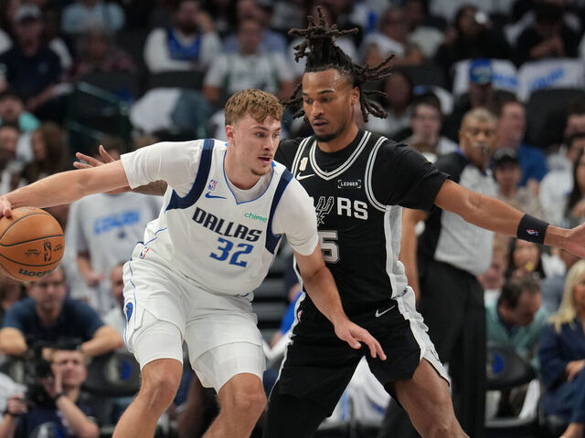 DALLAS, TX - OCTOBER 22: Cooper Flagg #32 of the Dallas Mavericks handles the ball as Stephon Castle #5 of the San Antonio Spurs plays defense during the game on OCTOBER 22, 2025 at American Airlines Center in Dallas, Texas. Mandatory Copyright Notice: Copyright 2025 NBAE