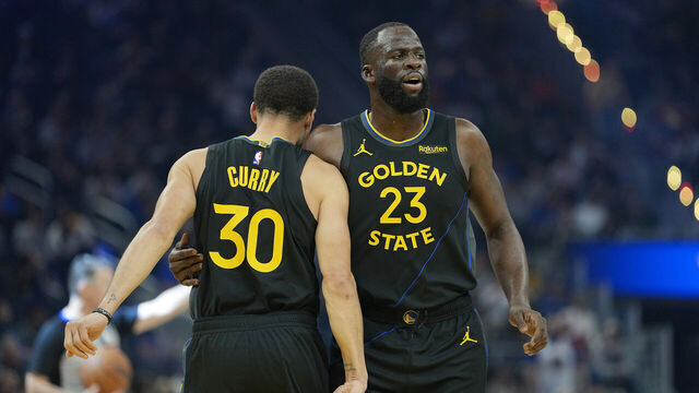 SAN FRANCISCO, CALIFORNIA - DECEMBER 20: Stephen Curry #30 and Draymond Green #23 of the Golden State Warriors prepare for the start of the game against the Phoenix Suns at Chase Center on December 20, 2025 in San Francisco, California.