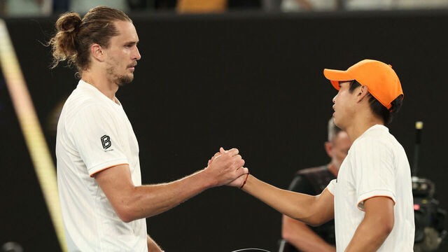 Germany's Alexander Zverev (L) shakes hands with USA's Learner Tien after their men's singles quarter-final match on day ten of the Australian Open tennis tournament in Melbourne on January 27, 2026. / -- IMAGE RESTRICTED TO EDITORIAL USE - STRICTLY NO COMMERCIAL USE --
