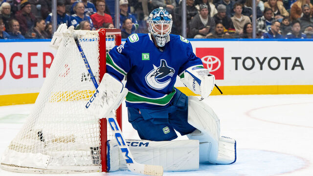 VANCOUVER, CANADA - DECEMBER 30: Thatcher Demko #35 of the Vancouver Canucks crouches in the crease during the second period of their NHL game against the Philadelphia Flyers at Rogers Arena on December 30, 2025 in Vancouver, Canada.