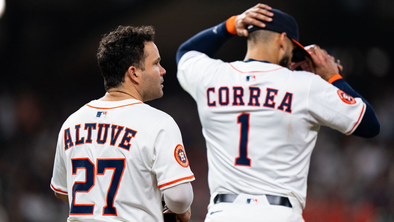 HOUSTON, TEXAS - SEPTEMBER 20: Jose Altuve #27 of the Houston Astros and Carlos Correa #1 take the field together in the fourth inning against the Seattle Mariners at Daikin Park on September 20, 2025 in Houston, Texas.