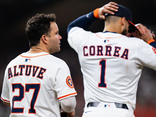 HOUSTON, TEXAS - SEPTEMBER 20: Jose Altuve #27 of the Houston Astros and Carlos Correa #1 take the field together in the fourth inning against the Seattle Mariners at Daikin Park on September 20, 2025 in Houston, Texas.