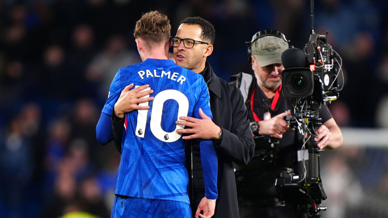 Chelsea's Cole Palmer greets manager Liam Rosenior following the Premier League match at Stamford Bridge, London. Picture date: Saturday January 17, 2026.