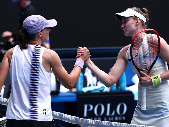 Kazakhstan's Elena Rybakina (R) shakes hands with Poland's Iga Swiatek after their women's singles quarter-final match on day eleven of the Australian Open tennis tournament in Melbourne on January 28, 2026. / -- IMAGE RESTRICTED TO EDITORIAL USE - STRICTLY NO COMMERCIAL USE --