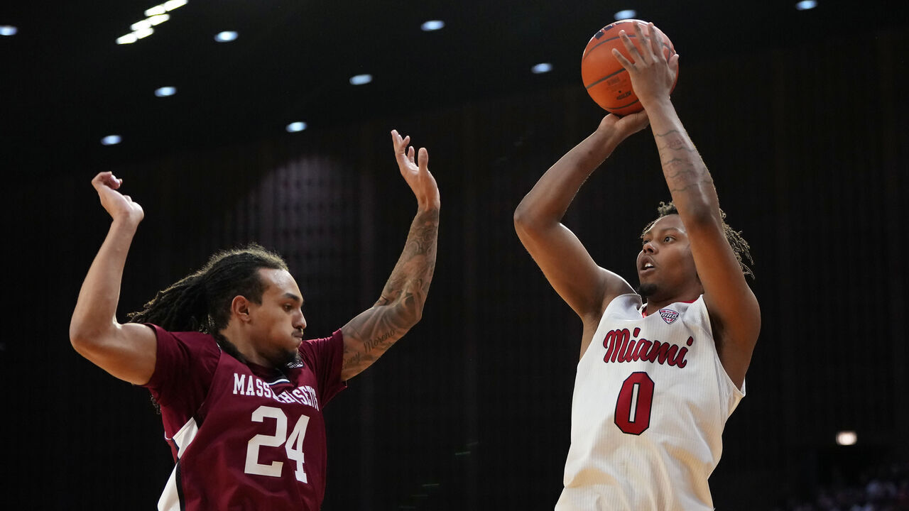 OXFORD, OHIO - JANUARY 27: Eian Elmer #0 of the Miami (OH) RedHawks shoots against Marcus Banks Jr. #24 of the UMass Minutemen in the second half at Millett Hall on January 27, 2026 in Oxford, Ohio.