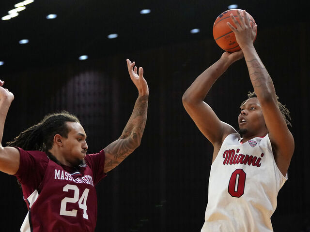 OXFORD, OHIO - JANUARY 27: Eian Elmer #0 of the Miami (OH) RedHawks shoots against Marcus Banks Jr. #24 of the UMass Minutemen in the second half at Millett Hall on January 27, 2026 in Oxford, Ohio.