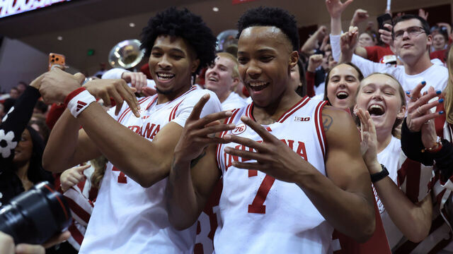 BLOOMINGTON, INDIANA - JANUARY 27: Sam Alexis #4 and Nick Dorn #7 of the Indiana Hoosiers celebrate with fans after defeating the Purdue Boilermakers at Simon Skjodt Assembly Hall on January 27, 2026 in Bloomington, Indiana.
