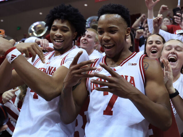 BLOOMINGTON, INDIANA - JANUARY 27: Sam Alexis #4 and Nick Dorn #7 of the Indiana Hoosiers celebrate with fans after defeating the Purdue Boilermakers at Simon Skjodt Assembly Hall on January 27, 2026 in Bloomington, Indiana.