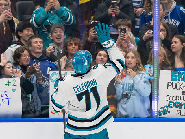 VANCOUVER, CANADA - JANUARY 27: Macklin Celebrini #71 of the San Jose Sharks receives a mini stick from fans during warmup prior to their NHL game against the Vancouver Canucks at Rogers Arena on January 27, 2026 in Vancouver, Canada.