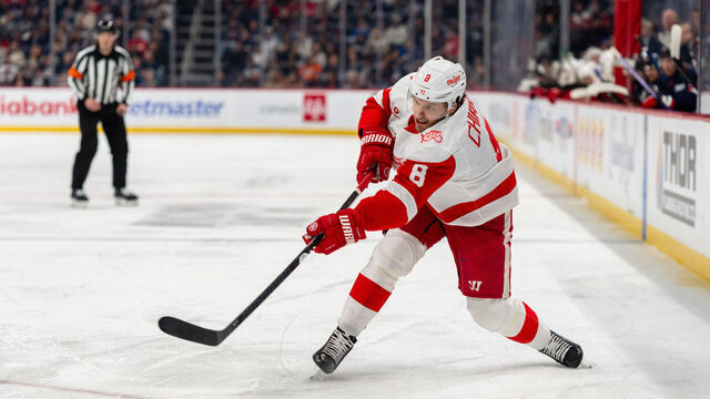 WINNIPEG, CANADA - JANUARY 24: Ben Chiarot #8 of the Detroit Red Wings shoots the puck in the first period against the Winnipeg Jets at Canada Life Centre on January 24, 2026 in Winnipeg, Canada.