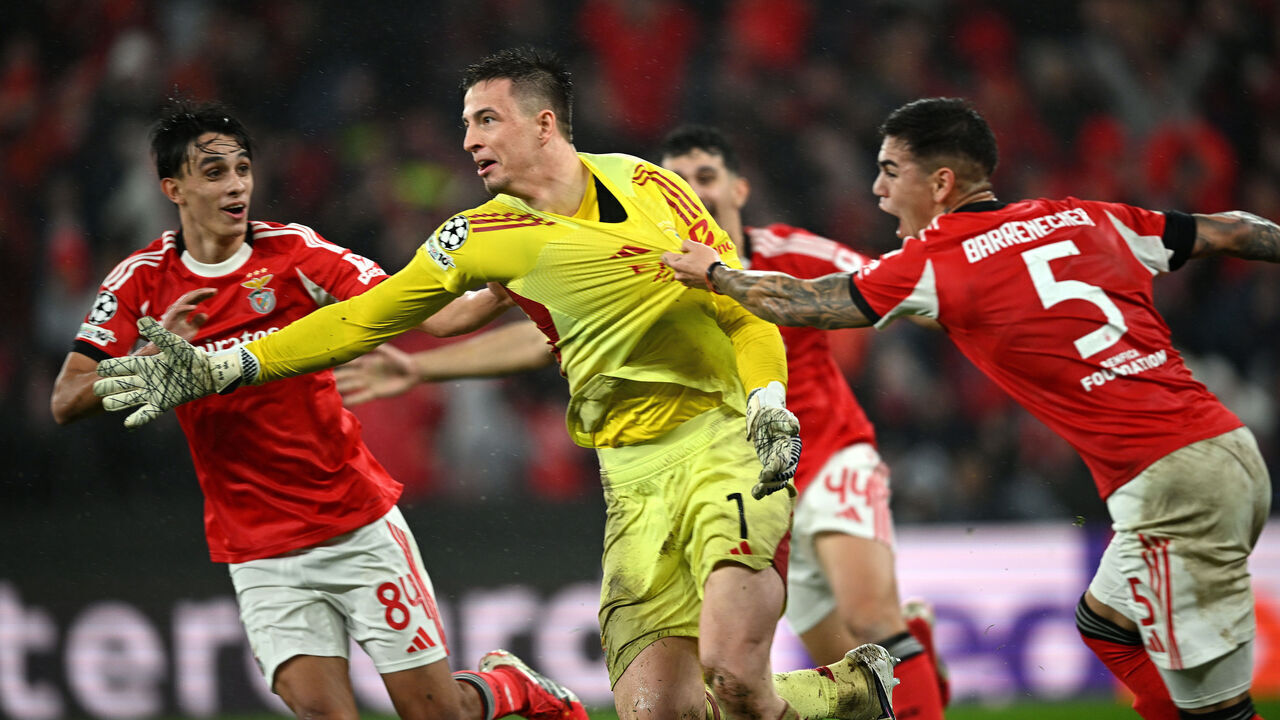 LISBON, PORTUGAL - JANUARY 28: Anatoliy Trubin of Benfica celebrates scoring his team's fourth goal with a header with teammates Joao Rego and Enzo Barrenechea during the UEFA Champions League 2025/26 League Phase MD8 match between SL Benfica and Real Madrid C.F. at Estadio do SL Benfica on January 28, 2026 in Lisbon, Portugal.