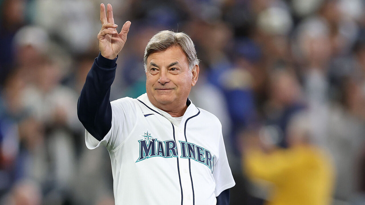 SEATTLE, WASHINGTON - OCTOBER 17: (L-R) Seattle Mariners broadcaster Rick Rizzs throws out the first pitch prior to game five of the American League Championship Series against the Toronto Blue Jays at T-Mobile Park on October 17, 2025 in Seattle, Washington.