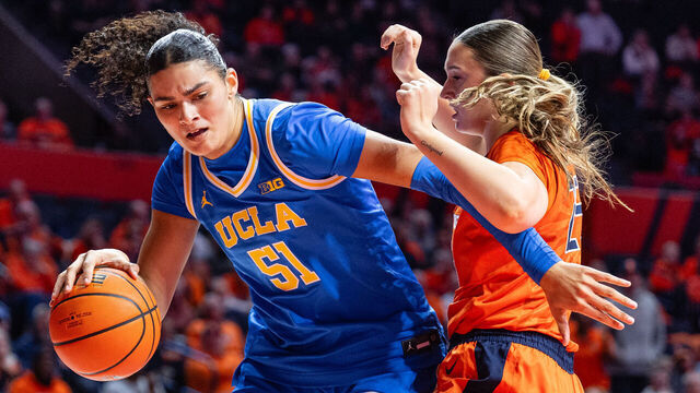 CHAMPAIGN, ILLINOIS - JANUARY 28: Lauren Betts #51 of the UCLA Bruins goes to the basket against Hayven Smith #25 of the Illinois Fighting Illini during the second half at State Farm Center on January 28, 2026 in Champaign, Illinois.