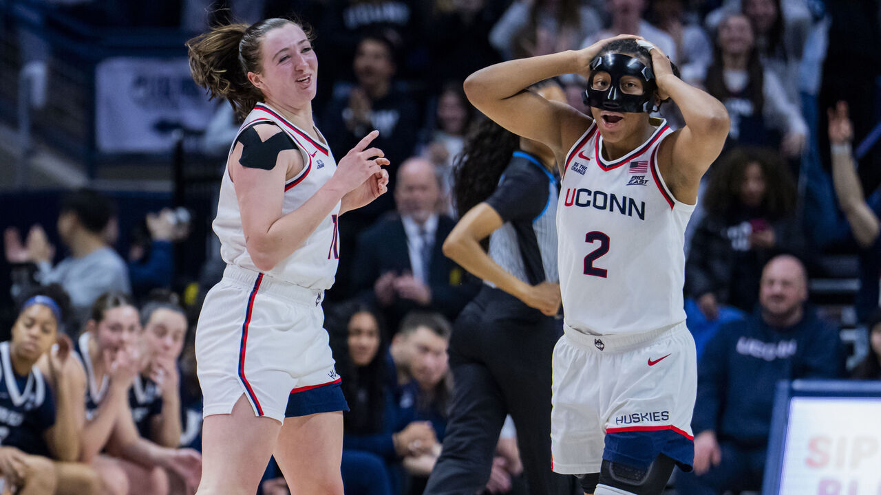 STORRS, CONNECTICUT - JANUARY 28: Allie Ziebell #11 and KK Arnold #2 of the Connecticut Huskies react after Ziebell's tenth three-point shot during the second half of the NCAA women's basketball game against the Xavier Musketeers at Harry A. Gampel Pavilion on January 28, 2026 in Storrs, Connecticut.