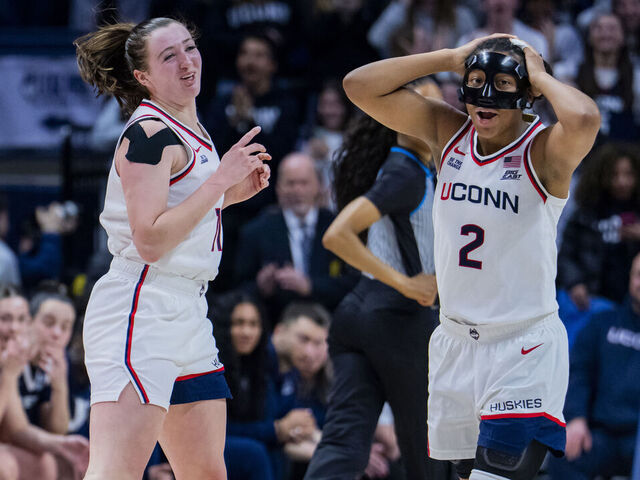 STORRS, CONNECTICUT - JANUARY 28: Allie Ziebell #11 and KK Arnold #2 of the Connecticut Huskies react after Ziebell's tenth three-point shot during the second half of the NCAA women's basketball game against the Xavier Musketeers at Harry A. Gampel Pavilion on January 28, 2026 in Storrs, Connecticut.