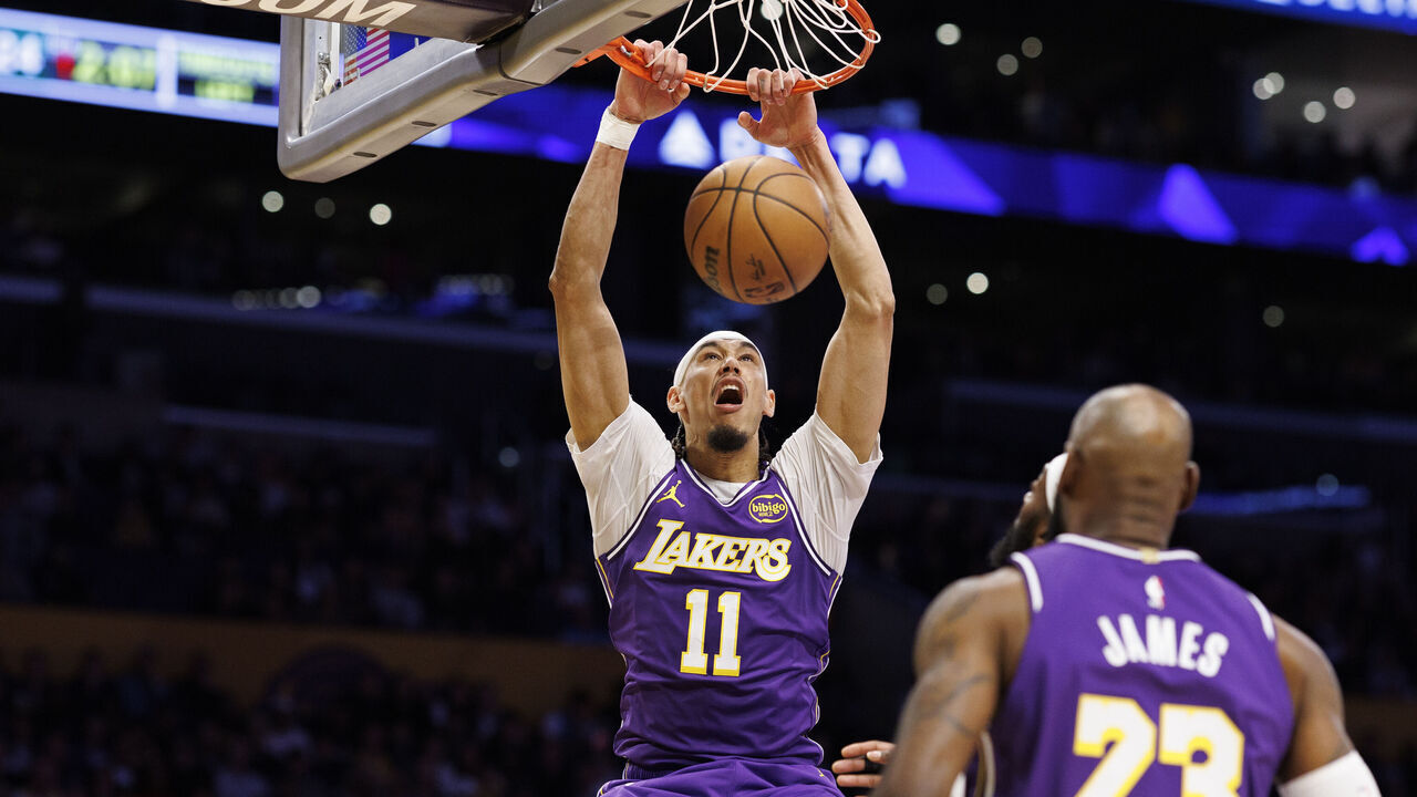 LOS ANGELES, CA - JANUARY 9, 2026: Los Angeles Lakers center Jaxson Hayes (11) scores on a dunk shot over Milwaukee Bucks guard Ryan Rollins (13) in the first half at Crypto.com Arena on January 9, 2026 in Los Angeles, California.(Gina Ferazzi / Los Angeles Times via Getty Images)