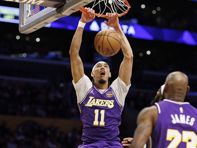 LOS ANGELES, CA - JANUARY 9, 2026: Los Angeles Lakers center Jaxson Hayes (11) scores on a dunk shot over Milwaukee Bucks guard Ryan Rollins (13) in the first half at Crypto.com Arena on January 9, 2026 in Los Angeles, California.(Gina Ferazzi / Los Angeles Times via Getty Images)