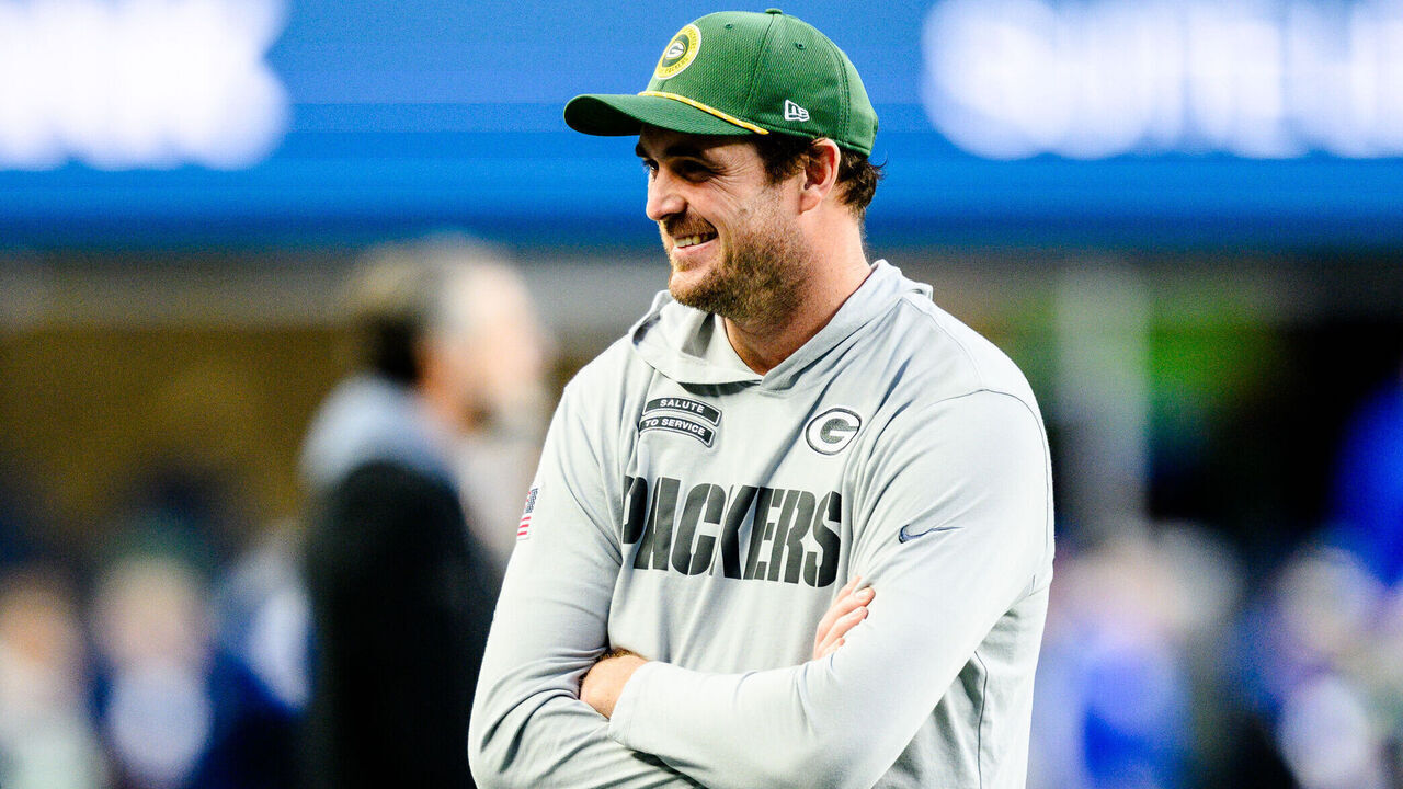 SEATTLE, WASHINGTON - DECEMBER 15: Special teams coordinator Jay Harbaugh of the Seattle Seahawks and Offensive assistant Sean Mannion of the Green Bay Packers chat prior to the game at Lumen Field on December 15, 2024 in Seattle, Washington.