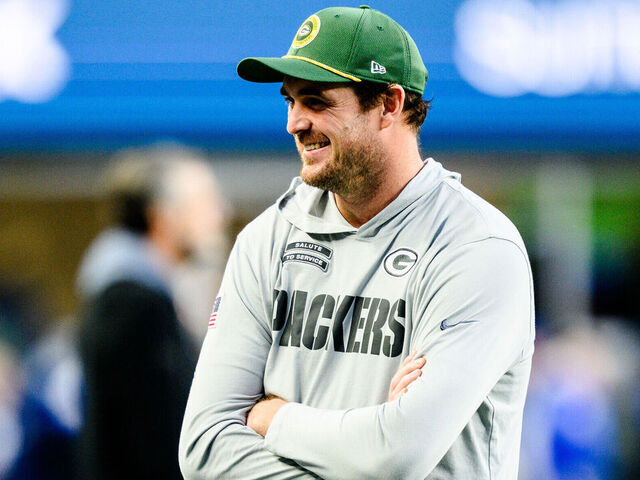 SEATTLE, WASHINGTON - DECEMBER 15: Special teams coordinator Jay Harbaugh of the Seattle Seahawks and Offensive assistant Sean Mannion of the Green Bay Packers chat prior to the game at Lumen Field on December 15, 2024 in Seattle, Washington.