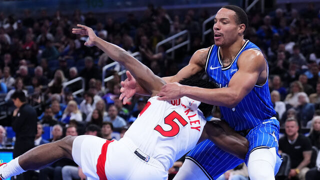 ORLANDO, FLORIDA - JANUARY 30: Desmond Bane #3 of the Orlando Magic fouls Immanuel Quickley #5 of the Toronto Raptors during the second quarter at Kia Center on January 30, 2026 in Orlando, Florida.