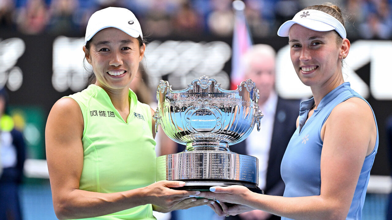 MELBOURNE, AUSTRALIA - JANUARY 31: China's Zhang Shuai and partner Belgium's Elise Mertens pose with the winners' trophy after their victory in their women's doubles final match against Kazakhstan's Anna Danilina and Serbia's Aleksandra Krunic on day fourteen of the 2026 Australian Open at Melbourne Park on January 31, 2026 in Melbourne, Australia.