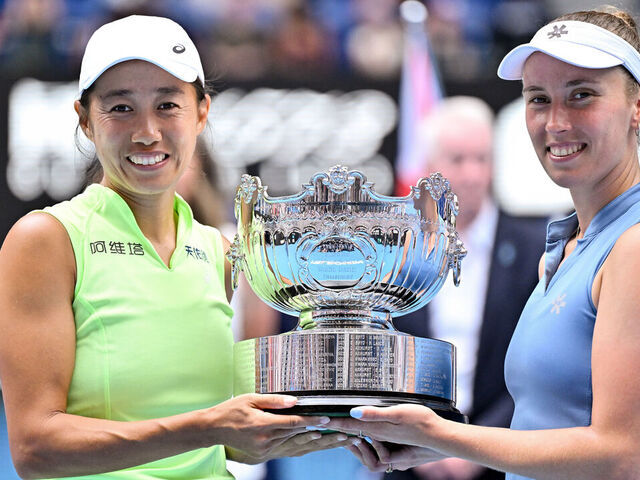 MELBOURNE, AUSTRALIA - JANUARY 31: China's Zhang Shuai and partner Belgium's Elise Mertens pose with the winners' trophy after their victory in their women's doubles final match against Kazakhstan's Anna Danilina and Serbia's Aleksandra Krunic on day fourteen of the 2026 Australian Open at Melbourne Park on January 31, 2026 in Melbourne, Australia.