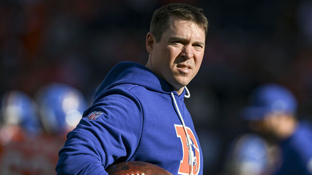 DENVER , CO - JANUARY 4: Secondary coach Jim Leonhard of the Denver Broncos stands on the field before the game against the Los Angeles Chargers at Empower Field at Mile High in Denver, Colorado on Sunday, January 4, 2026.