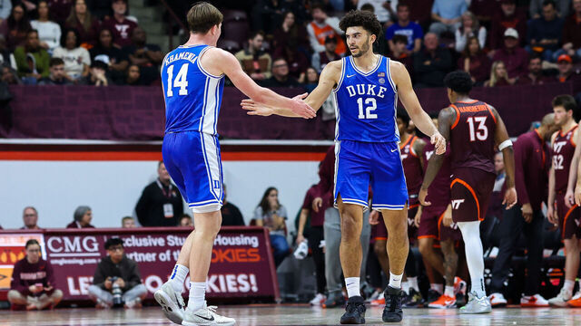 BLACKSBURG, VIRGINIA - JANUARY 31: Nikolas Khamenia #14 and Cameron Boozer #12 of the Duke Blue Devils react in the second half during a game against the Virginia Tech Hokies at Cassell Coliseum on January 31, 2026 in Blacksburg, Virginia.