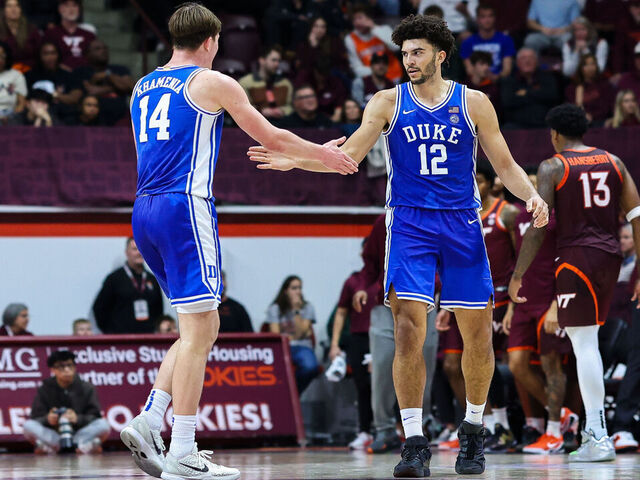 BLACKSBURG, VIRGINIA - JANUARY 31: Nikolas Khamenia #14 and Cameron Boozer #12 of the Duke Blue Devils react in the second half during a game against the Virginia Tech Hokies at Cassell Coliseum on January 31, 2026 in Blacksburg, Virginia.