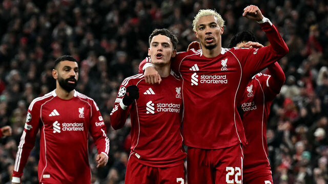 TOPSHOT - Liverpool's German midfielder #07 Florian Wirtz celebrates scoring the team's second goal with Liverpool's French striker #22 Hugo Ekitike (2R) during the UEFA Champions League football match between Liverpool and Qarabag at Anfield in Liverpool, north west England on January 28, 2026.