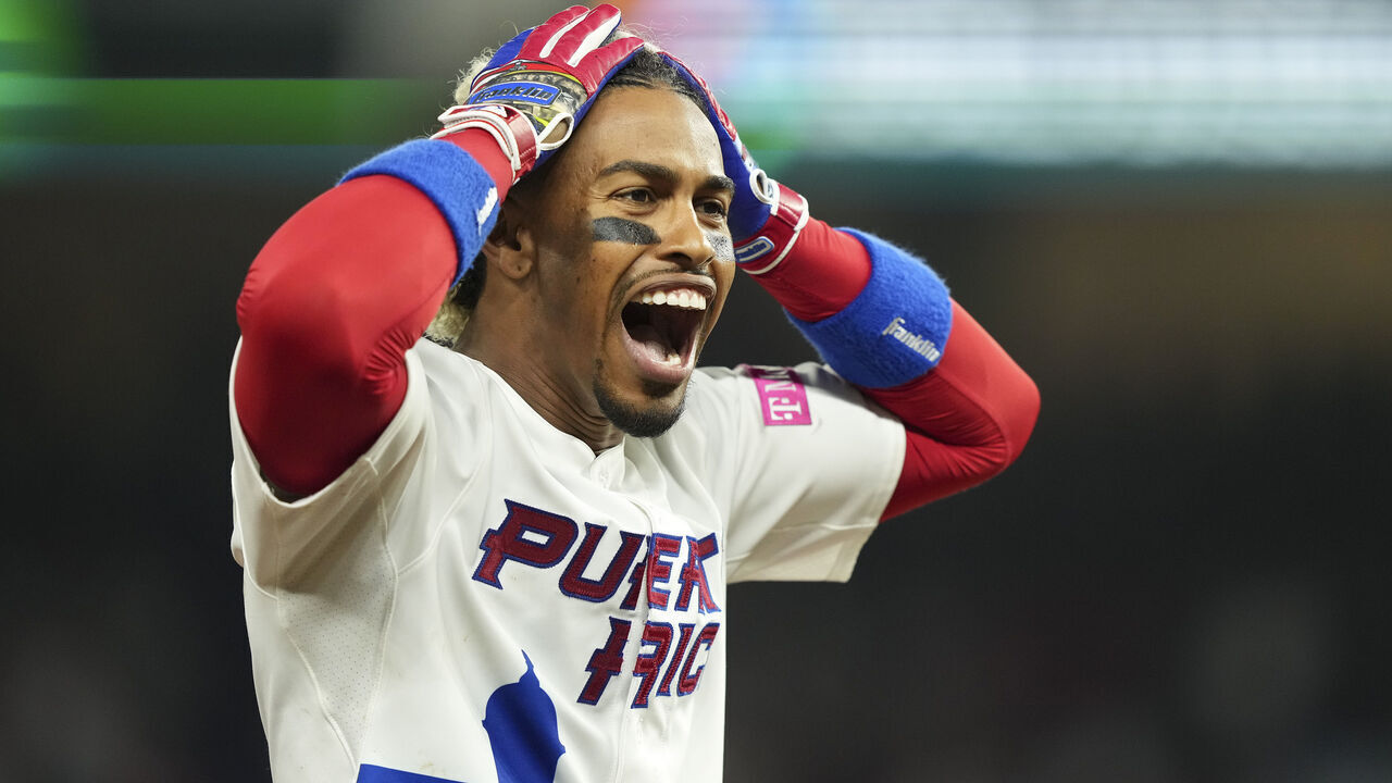 MIAMI, FLORIDA - MARCH 13: Francisco Lindor #12 of Puerto Rico celebrates after hitting a triple in the fifth inning against Israel at loanDepot park on March 13, 2023 in Miami, Florida.
