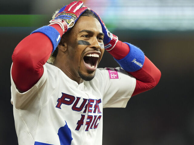 MIAMI, FLORIDA - MARCH 13: Francisco Lindor #12 of Puerto Rico celebrates after hitting a triple in the fifth inning against Israel at loanDepot park on March 13, 2023 in Miami, Florida.