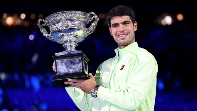MELBOURNE, AUSTRALIA - FEBRUARY 01: Carlos Alcaraz of Spain poses with the Norman Brookes Challenge Cup at the presentation ceremony after his victory in the Men's Singles Final against Novak Djokovic of Serbia during day 15 of the 2026 Australian Open at Melbourne Park on February 01, 2026 in Melbourne, Australia.