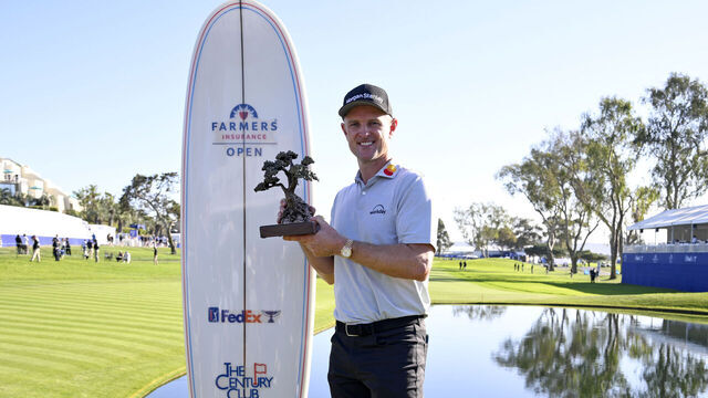 LA JOLLA, CALIFORNIA - FEBRUARY 01: Justin Rose of England poses with the trophy after putting in to win on the 18th green during the final round of the Farmers Insurance Open 2026 at Torrey Pines South Course on February 01, 2026 in La Jolla, California.