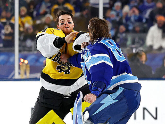 TAMPA, FLORIDA - FEBRUARY 01: Jeremy Swayman #1 of the Boston Bruins and Andrei Vasilevskiy #88 of the Tampa Bay Lightning fight during the second period of the 2026 NHL Stadium Series at Raymond James Stadium on February 01, 2026 in Tampa, Florida.