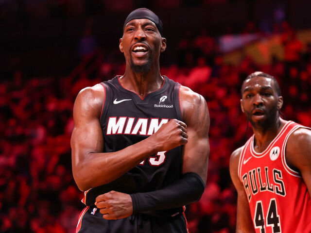 MIAMI, FLORIDA - FEBRUARY 01: Bam Adebayo #13 of the Miami Heat celebrates after a dunk in front of Patrick Williams #44 of the Chicago Bulls during the second quarter of the game at Kaseya Center on February 01, 2026 in Miami, Florida.