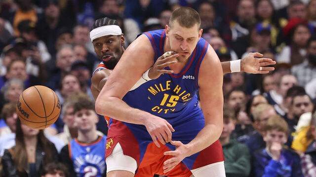 DENVER, COLORADO - FEBRUARY 01: Shai Gilgeous-Alexander #2 of the Oklahoma City Thunder steals the ball from Nikola Jokic #15 of the Denver Nuggets during the fourth quarter at Ball Arena on February 1, 2026 in Denver, Colorado.