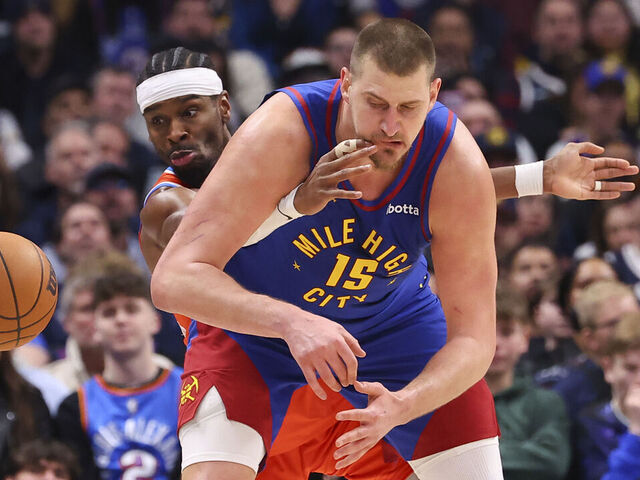DENVER, COLORADO - FEBRUARY 01: Shai Gilgeous-Alexander #2 of the Oklahoma City Thunder steals the ball from Nikola Jokic #15 of the Denver Nuggets during the fourth quarter at Ball Arena on February 1, 2026 in Denver, Colorado.