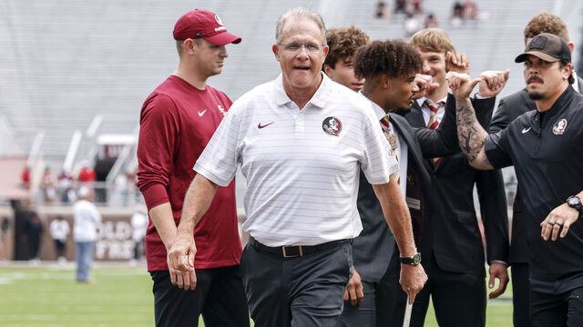 TALLAHASSEE, FL - AUGUST 30: Offensive Coordinator Guz Malzahn of the Florida State Seminoles on the field talking with his quarterbacks prior to the game against the Alabama Crimson Tide at Doak S. Campbell Stadium on Bobby Bowden Field on August 30, 2025 in Tallahassee, Florida.