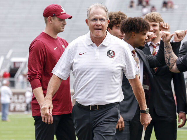 TALLAHASSEE, FL - AUGUST 30: Offensive Coordinator Guz Malzahn of the Florida State Seminoles on the field talking with his quarterbacks prior to the game against the Alabama Crimson Tide at Doak S. Campbell Stadium on Bobby Bowden Field on August 30, 2025 in Tallahassee, Florida.
