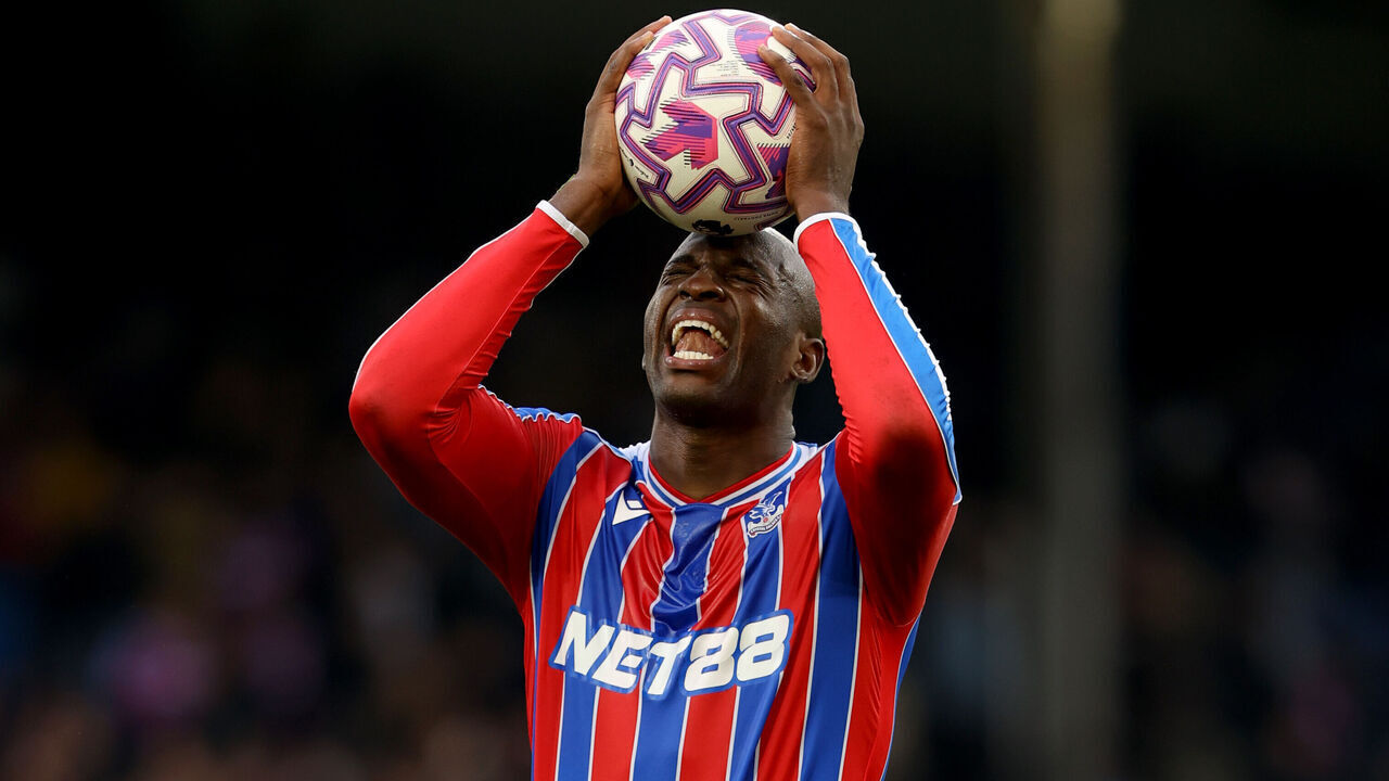 LONDON, ENGLAND - OCTOBER 18: Jean-Philippe Mateta of Crystal Palace holds the match ball after his hat-trick but reacts possibly with thoughts of a late missed chance - during the Premier League match between Crystal Palace and Bournemouth at Selhurst Park on October 18, 2025 in London, England.