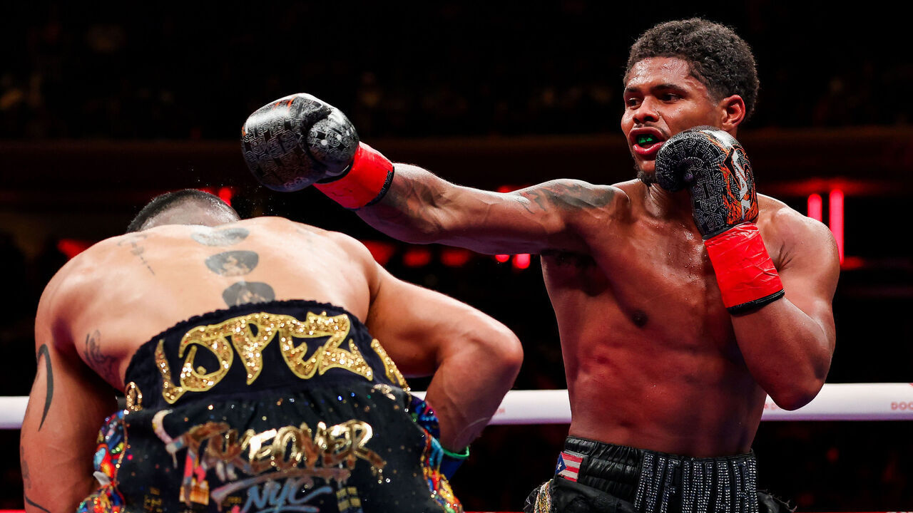 NEW YORK, NEW YORK - JANUARY 31: Shakur Stevenson punches Teofimo Lopez in the super lightweight bout for the World Boxing Organization title during The Ring 6 fight at Madison Square Garden on January 31, 2026 in New York City.