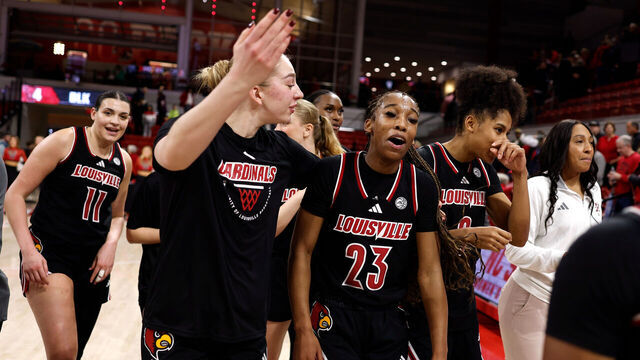 RALEIGH, NORTH CAROLINA - JANUARY 18: Skylar Jones #23 of the Louisville Cardinals celebrates with teammates following their overtime win against the NC State Wolfpack at Reynolds Coliseum on January 18, 2026 in Raleigh, North Carolina.