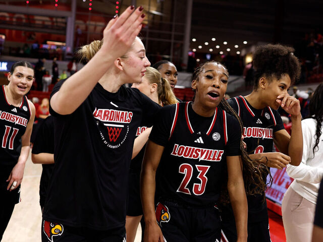 RALEIGH, NORTH CAROLINA - JANUARY 18: Skylar Jones #23 of the Louisville Cardinals celebrates with teammates following their overtime win against the NC State Wolfpack at Reynolds Coliseum on January 18, 2026 in Raleigh, North Carolina.