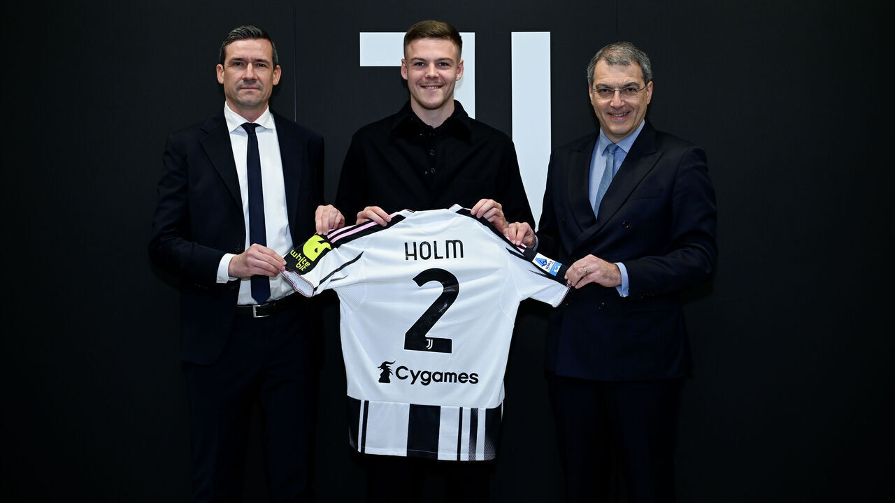 TURIN, ITALY - FEBRUARY 2: Juventus New Signing Emil Holm with Damien Comolli and Marco Ottolini at Juventus headquarters on February 2, 2026 in Turin, Italy.