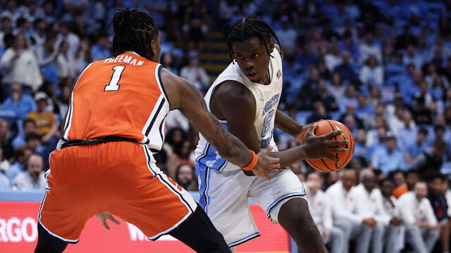 CHAPEL HILL, NORTH CAROLINA - FEBRUARY 02: Caleb Wilson #8 of the North Carolina Tar Heels looks to get past Donnie Freeman #1 of the Syracuse Orange during the second half of a basketball game at Dean E. Smith Center on February 02, 2026 in Chapel Hill, North Carolina.